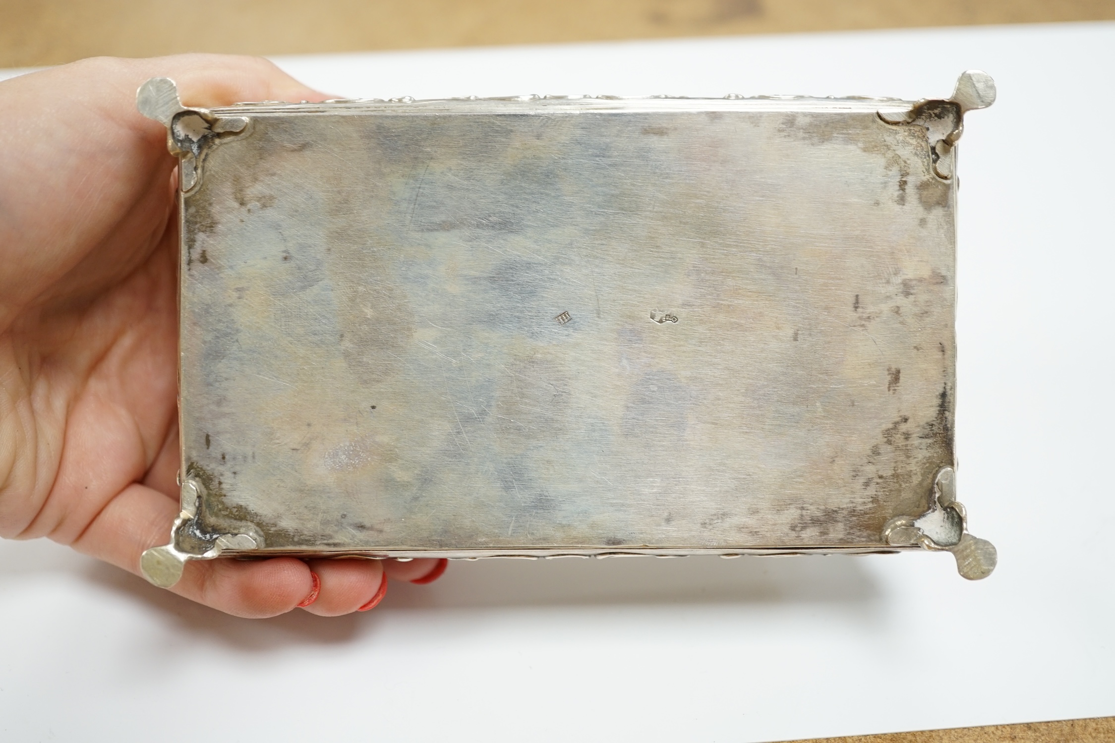 A late 19th century Dutch white metal bombe shaped rectangular trinket box, 14cm, together with an Edwardian silver trinket box, London, 1908.